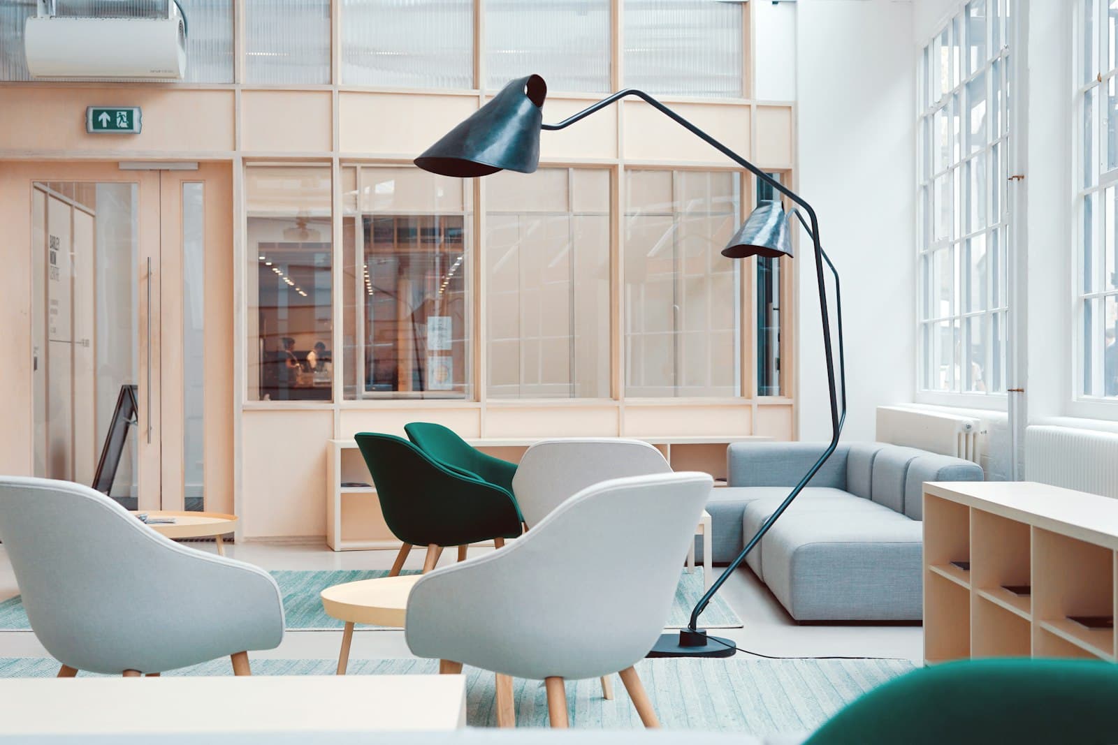 A bright Scandinavian interior with soft chairs and warm wood